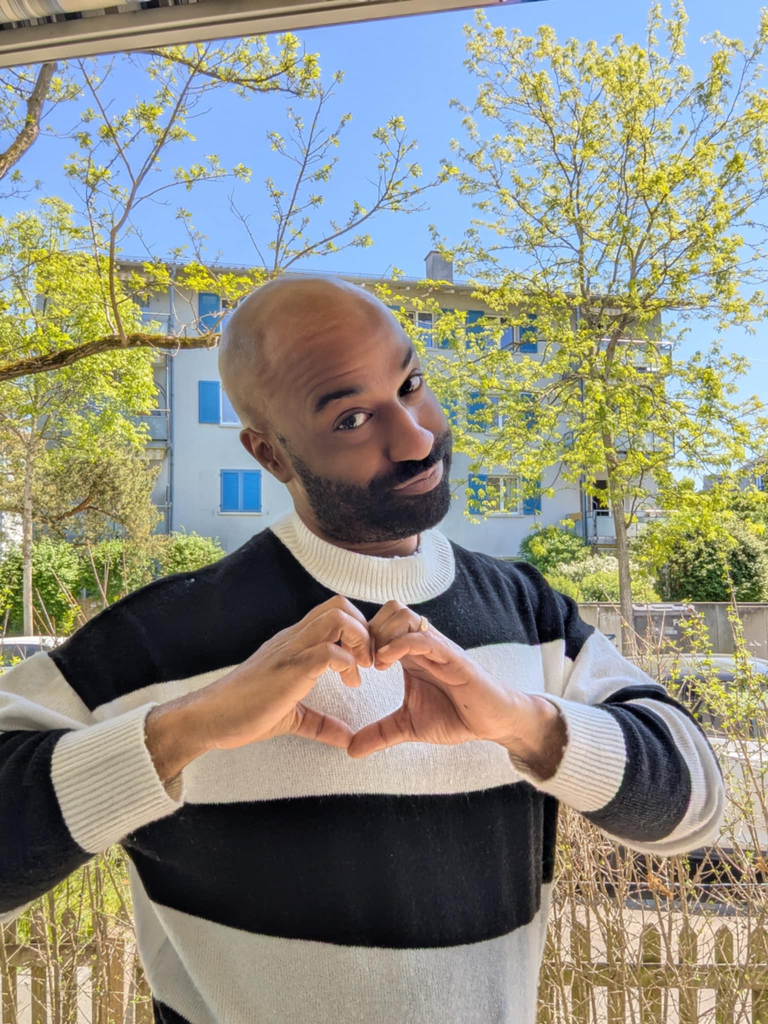 Ruben Garica - Professional comedian making a heart gesture with his hands